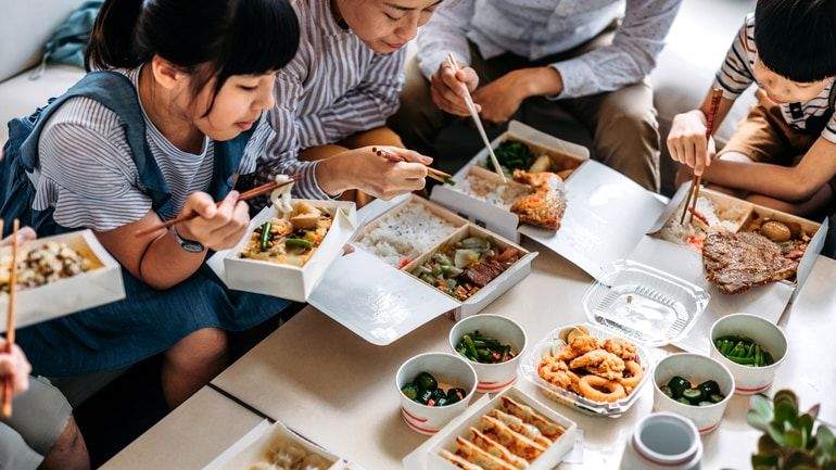 Family eating a takeout meal