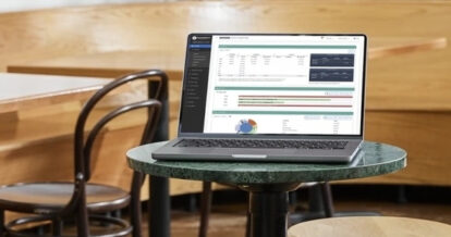 TouchBistro Profit Management on the screen of a laptop in a restaurant.
