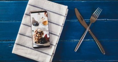 Smart phone with linen napkin and cutlery